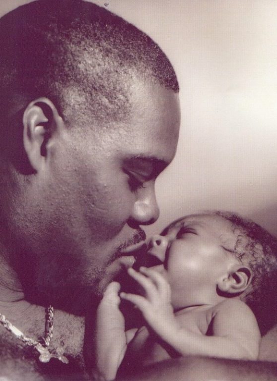 Jones during his Browns days, holding his firstborn son.